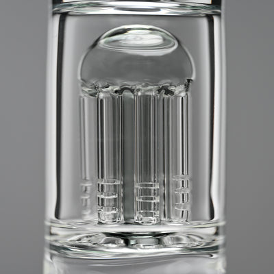 Close-up image of the intricate 8-arm percolator inside a glass beaker bong. The percolator's precise, clean lines and craftsmanship are highlighted against a soft grey background, showcasing the attention to detail and quality of the bong's design.