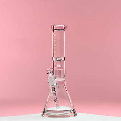 A glass beaker bong with pink accents and the Castle Glassworks logo on the neck. The bong features an eight-arm percolator and is set against a soft pink background, highlighting its elegant design and intricate details. The overall aesthetic is clean and modern, emphasizing the craftsmanship and quality of the piece.
